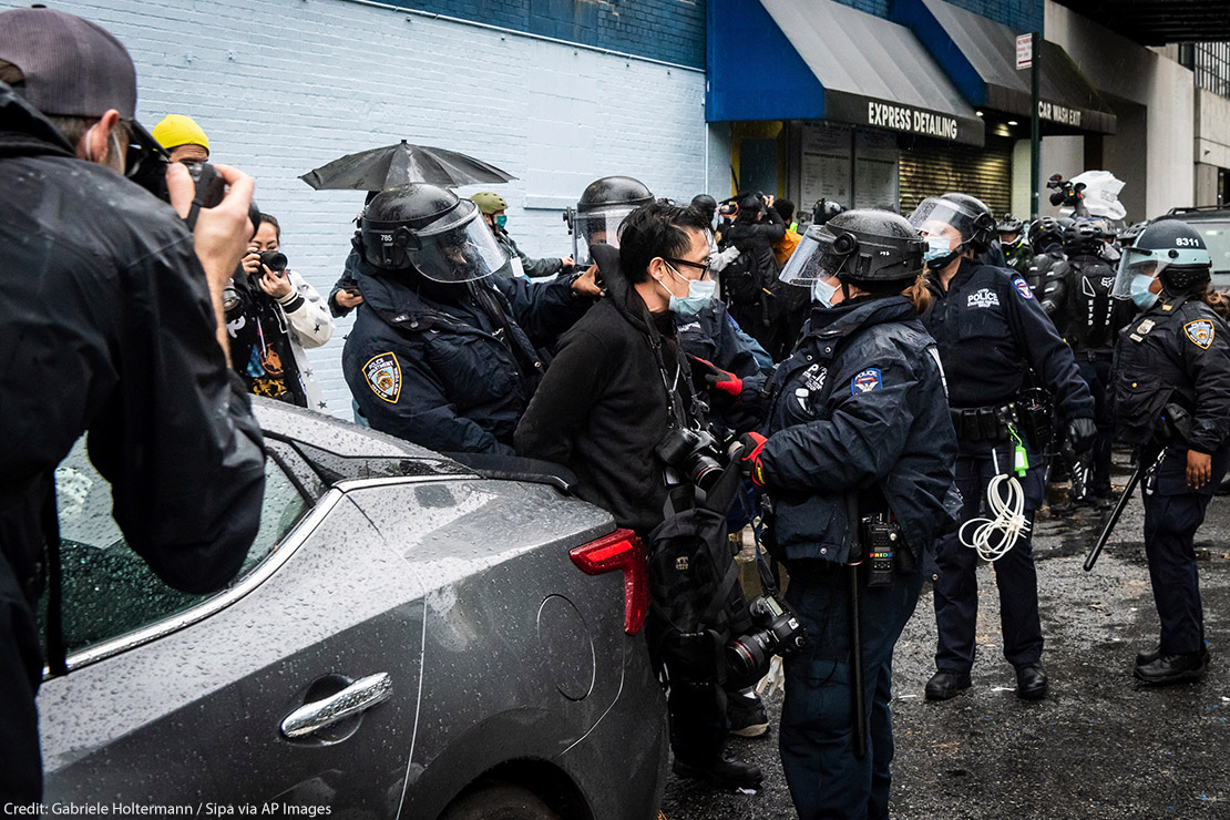 A photojournalist is arrested by NYPD officers during an anti-Trump protest in New York City