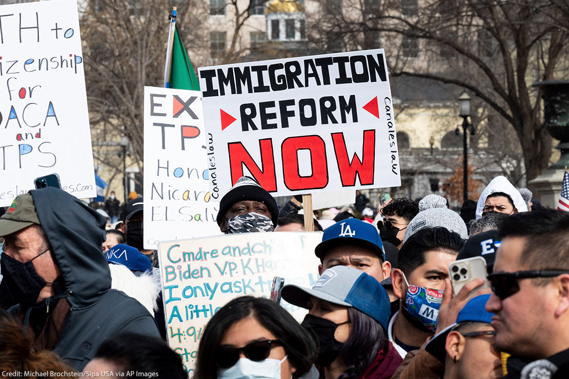 A group of immigration reform demonstrators with a sign that says "Immigration Reform Now."