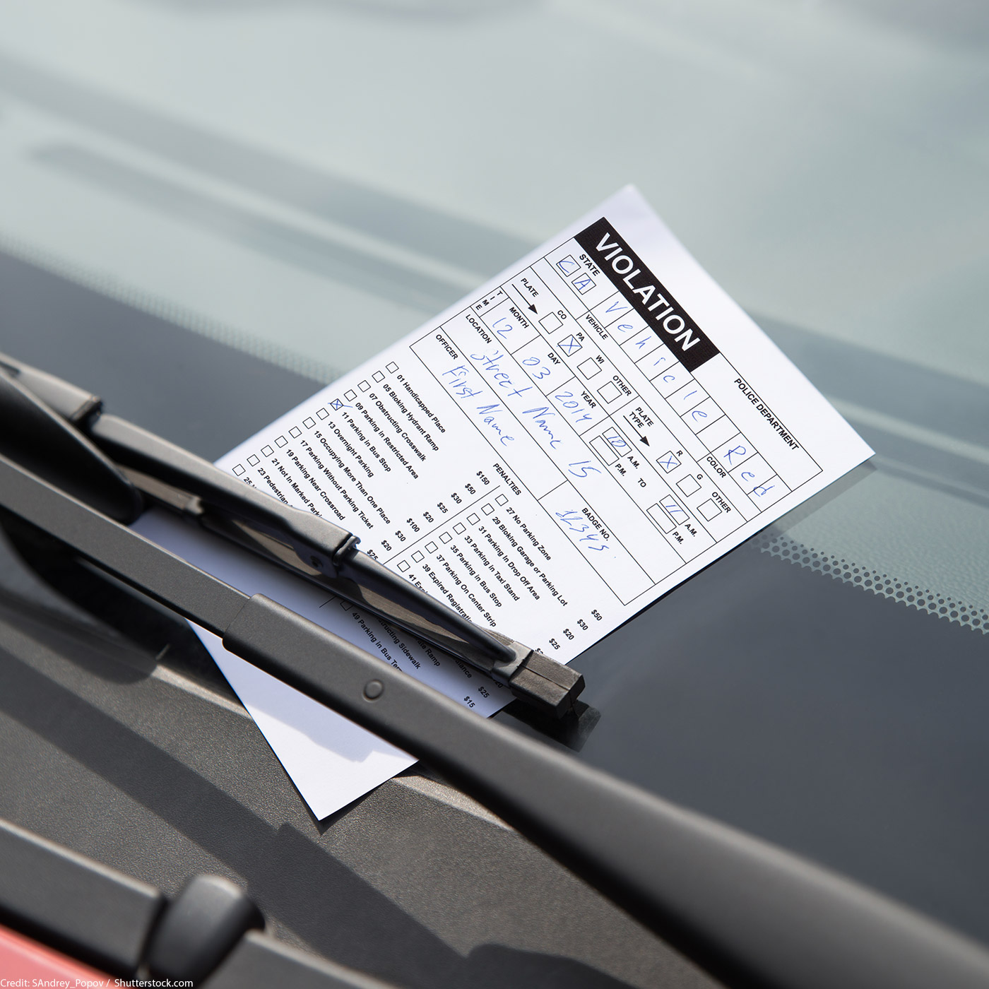 Traffic violation on a windshield.