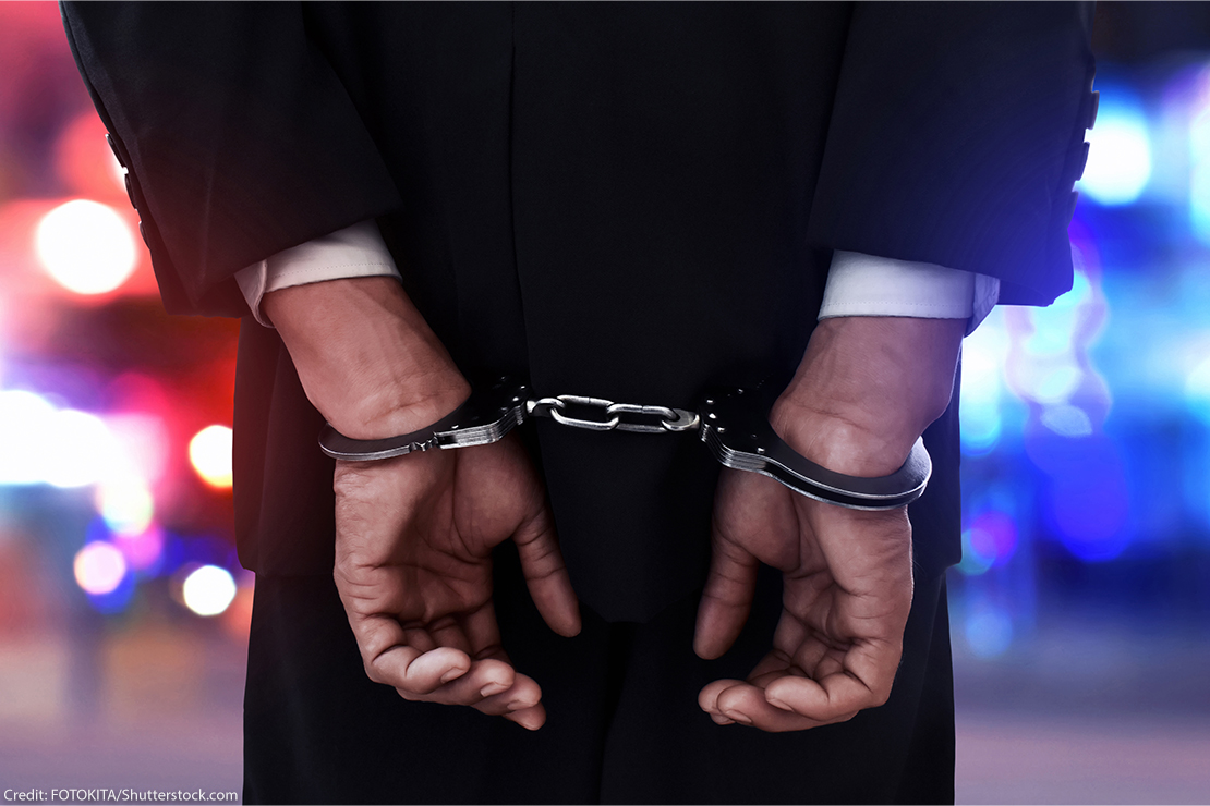 Businessman in handcuffs