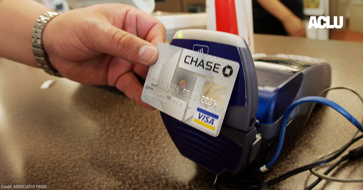 A customer uses a contactless credit card at a card reader