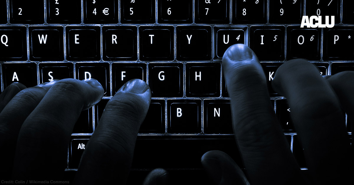 A backlit laptop computer keyboard. Most fingers are on the &quot;home&quot; keys for touch-typing; the &#039;U&#039; key is being pressed.